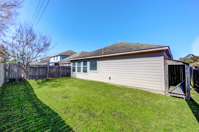 a backyard of a house with lots of green space