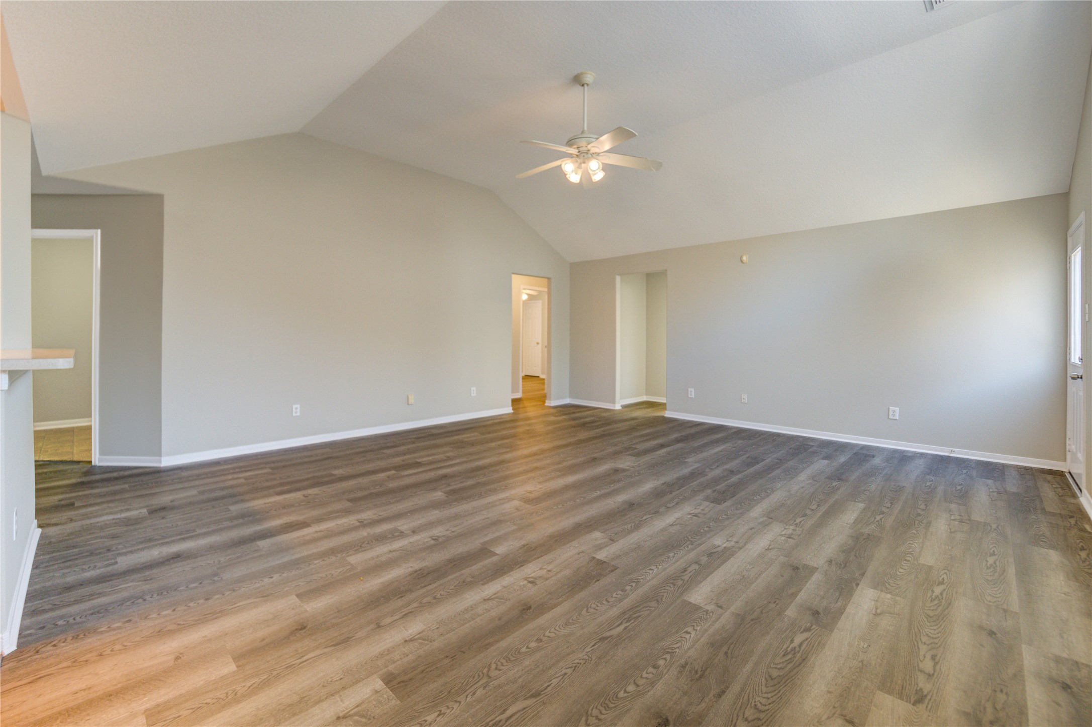 19427 Harvest Stream Way Houston, TX 77084 - Photo 5 of 38 a view of empty room with wooden floor and ceiling fan