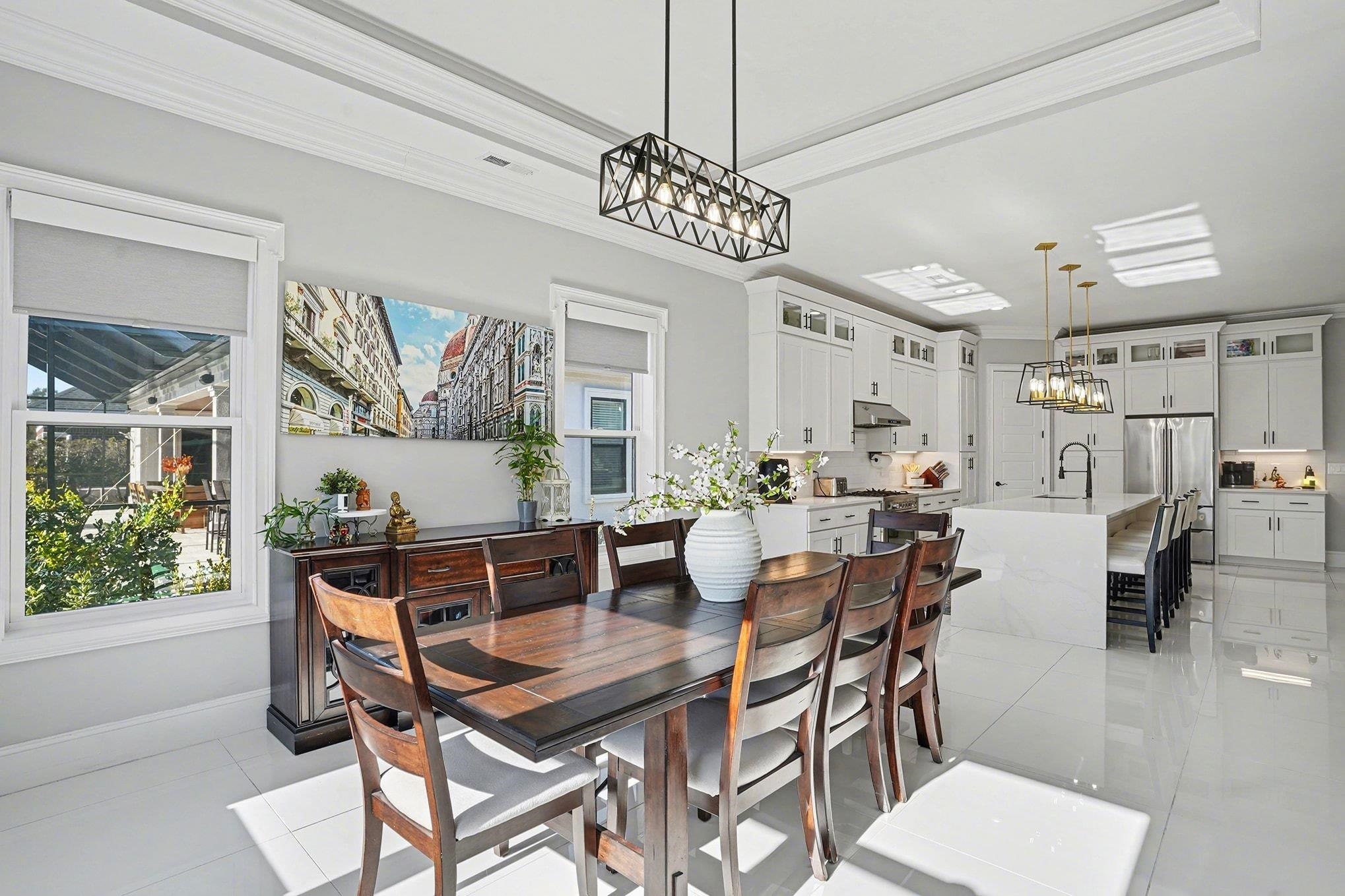 902 Shipmaster Avenue Myrtle Beach, SC 29579 - Photo 12 of 40 Dining area with crown molding, a chandelier, and light tile patterned flooring