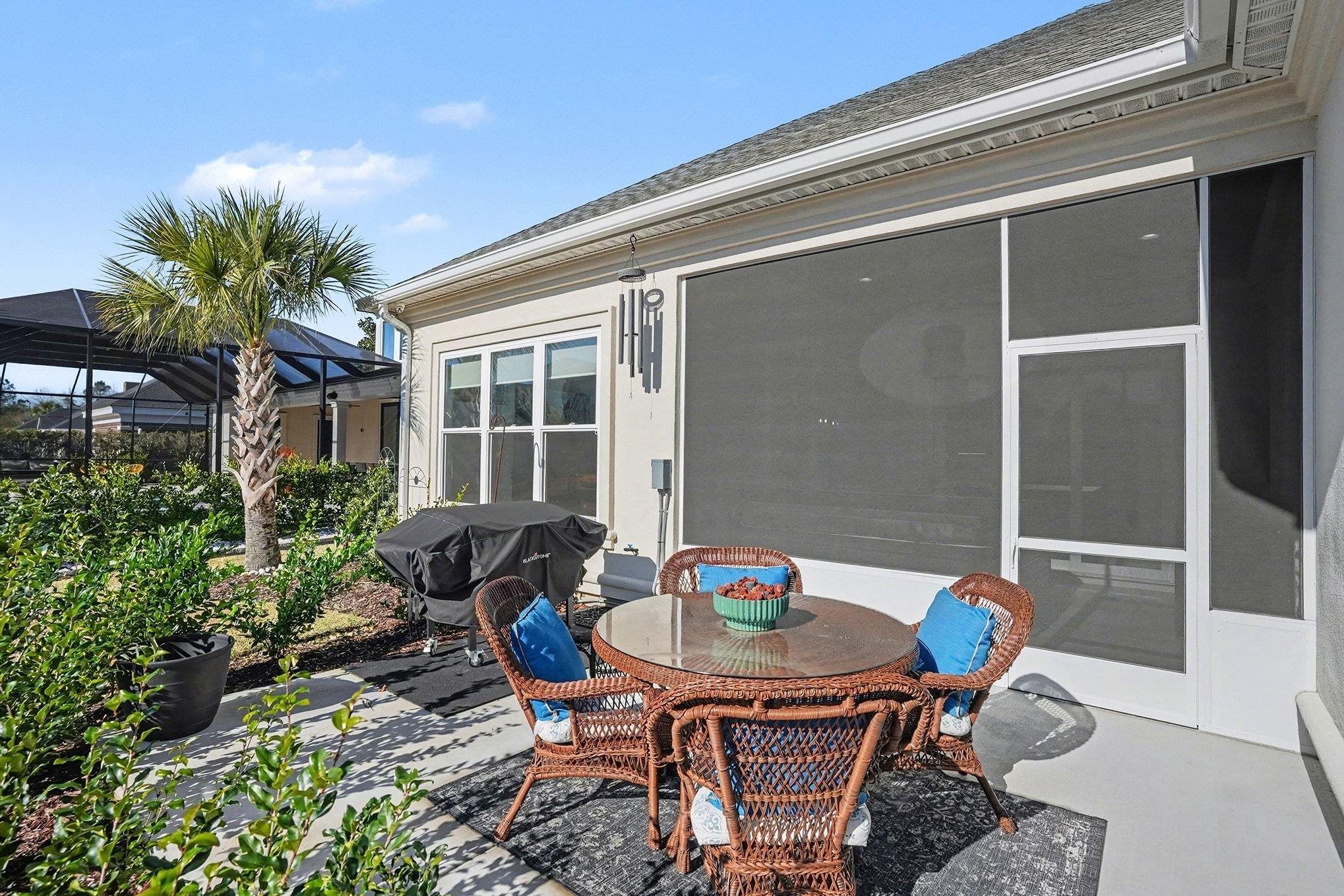 902 Shipmaster Avenue Myrtle Beach, SC 29579 - Photo 31 of 40 View of patio / terrace featuring outdoor dining area, glass enclosure, and grilling area