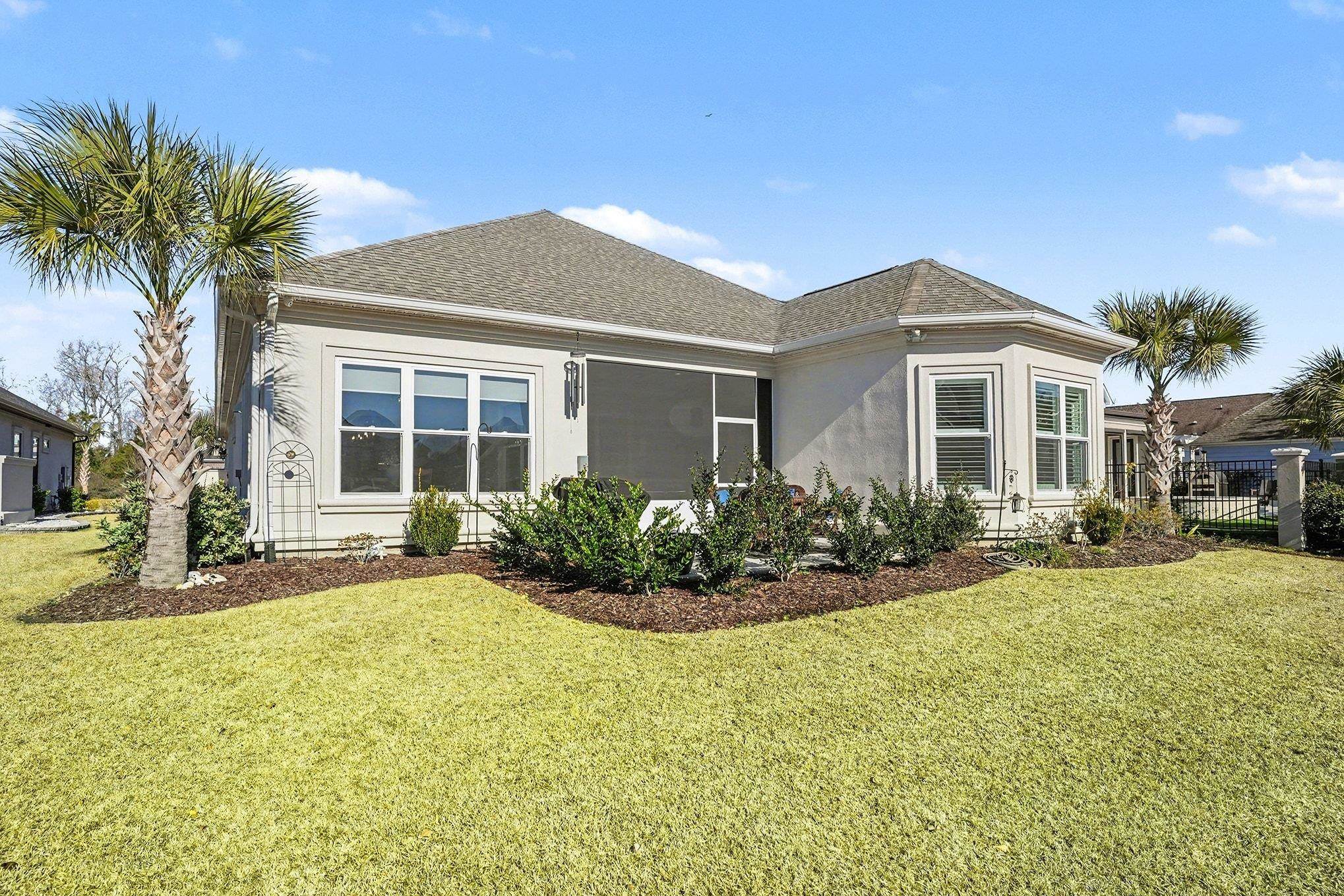 902 Shipmaster Avenue Myrtle Beach, SC 29579 - Photo 33 of 40 Rear view of house featuring roof with shingles and stucco siding