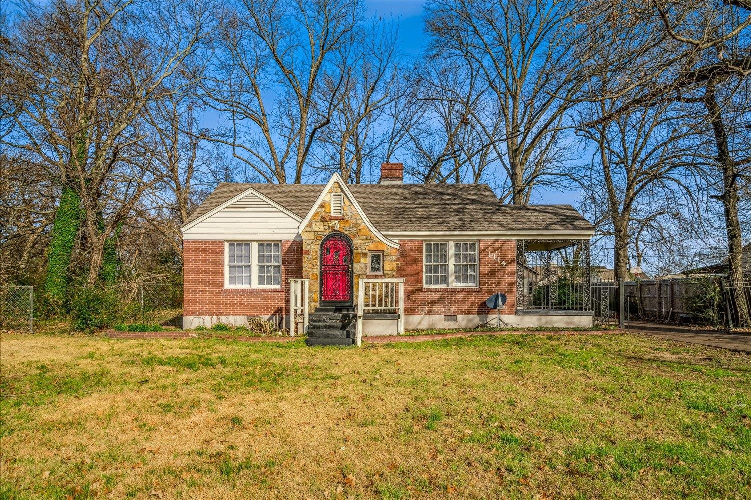 1114 Brownlee Road Memphis, TN 38116 - Photo 2 of 32 English style home featuring brick siding, a chimney, and roof with shingles