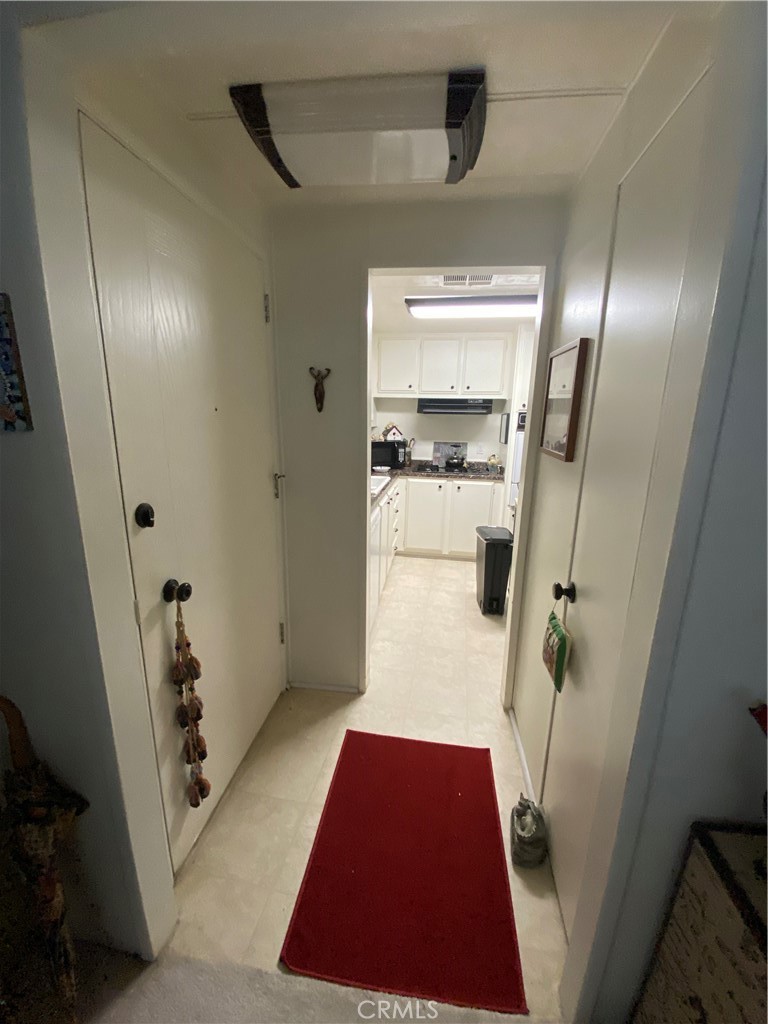12680 4th Street, Unit 39 Yucaipa, CA 92399 - Photo 15 of 45 a hallway view with a fireplace