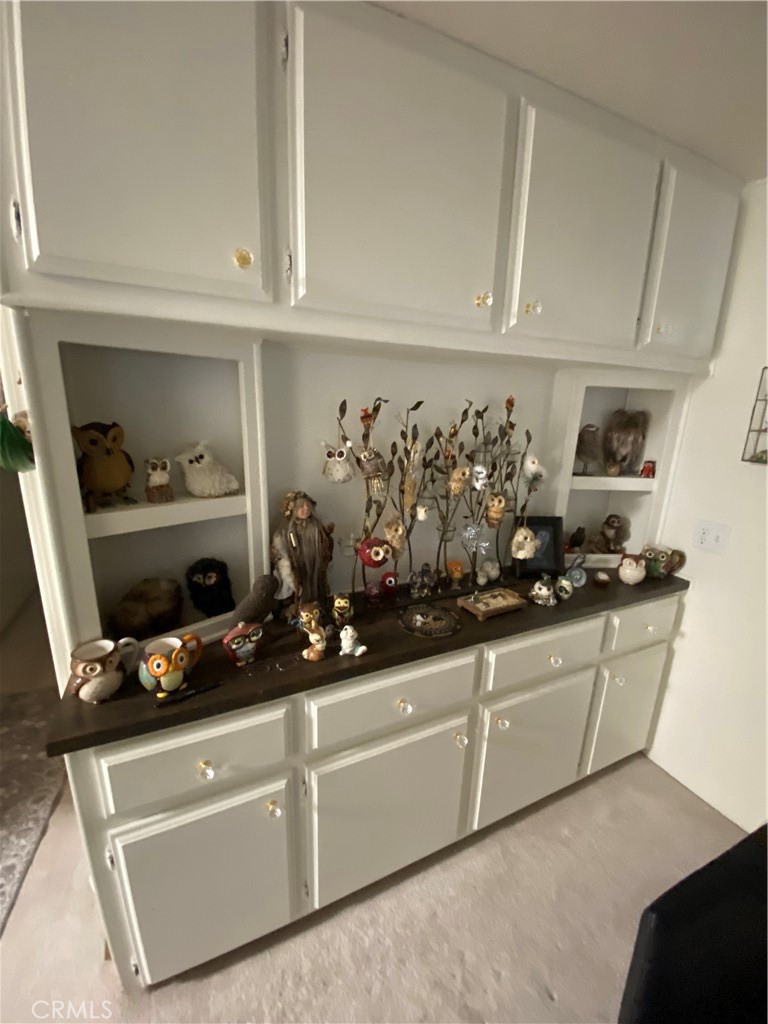 12680 4th Street, Unit 39 Yucaipa, CA 92399 - Photo 20 of 45 a counter top with white cabinets and sink