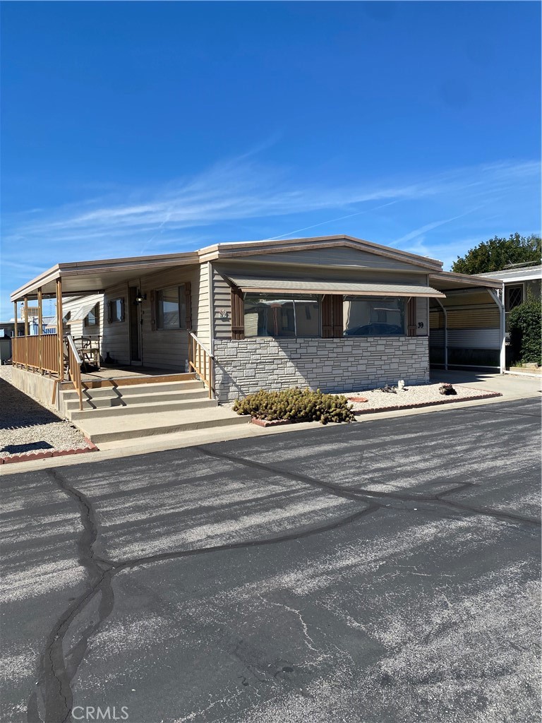12680 4th Street, Unit 39 Yucaipa, CA 92399 - Photo 2 of 45 a view of the house with a patio