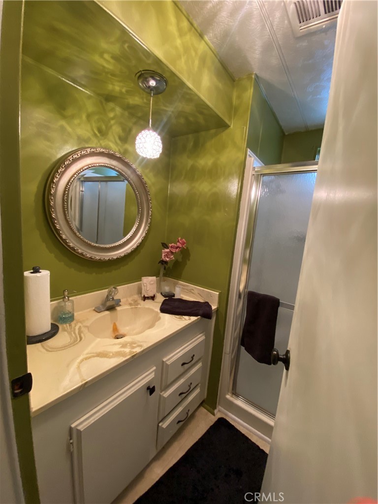 12680 4th Street, Unit 39 Yucaipa, CA 92399 - Photo 23 of 45 a bathroom with a sink and a mirror
