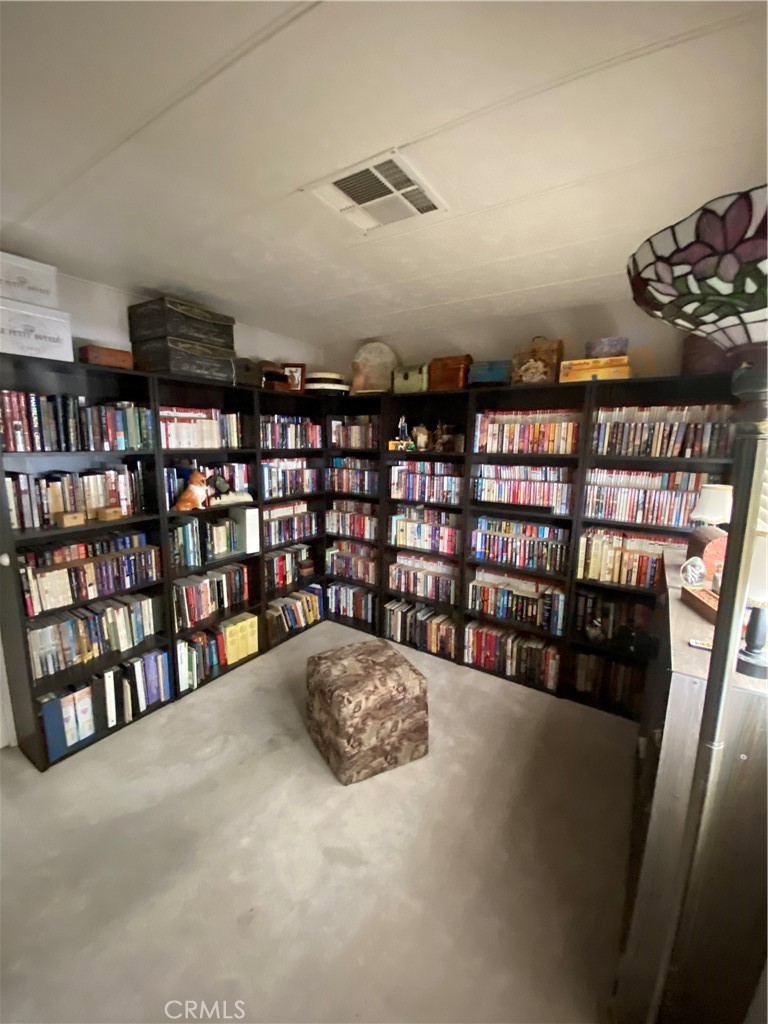 12680 4th Street, Unit 39 Yucaipa, CA 92399 - Photo 26 of 45 a view of livingroom with furniture and book shelf