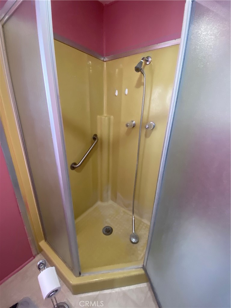 12680 4th Street, Unit 39 Yucaipa, CA 92399 - Photo 33 of 45 a bathroom with a glass door shower