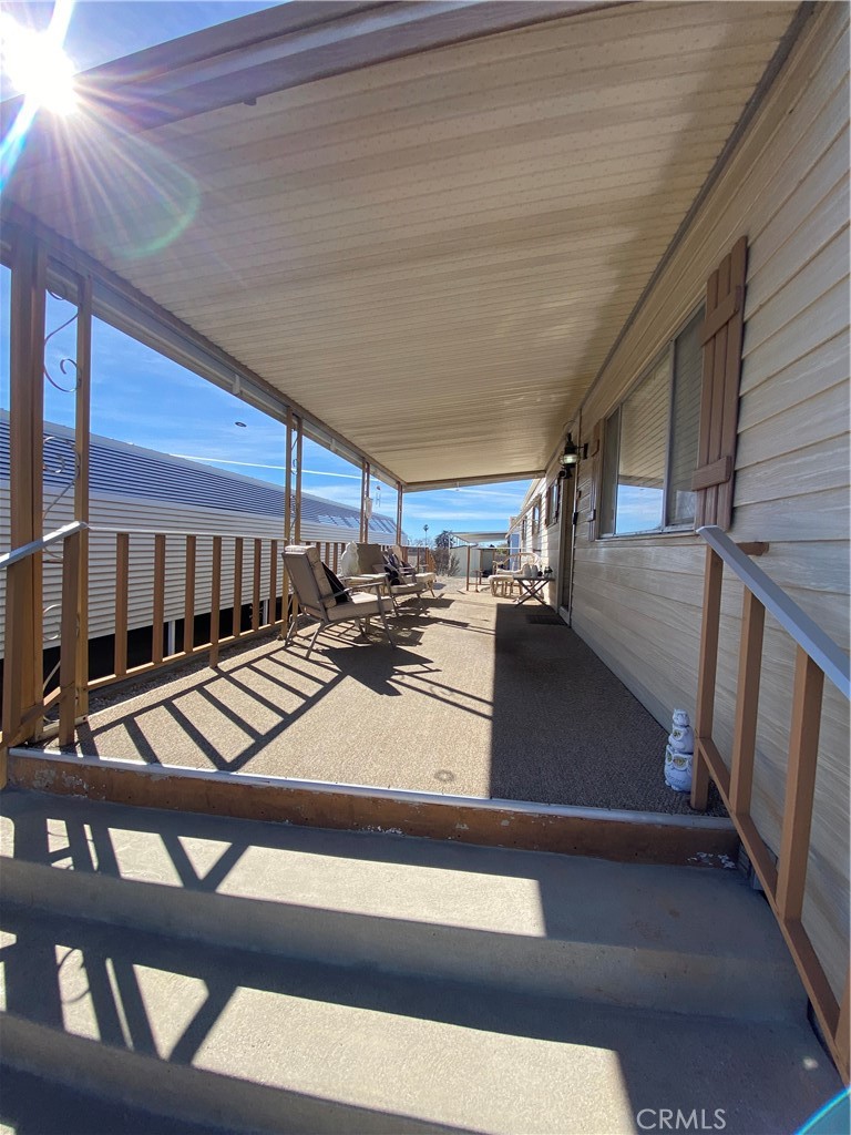 12680 4th Street, Unit 39 Yucaipa, CA 92399 - Photo 6 of 45 a view of a hall with wooden floor