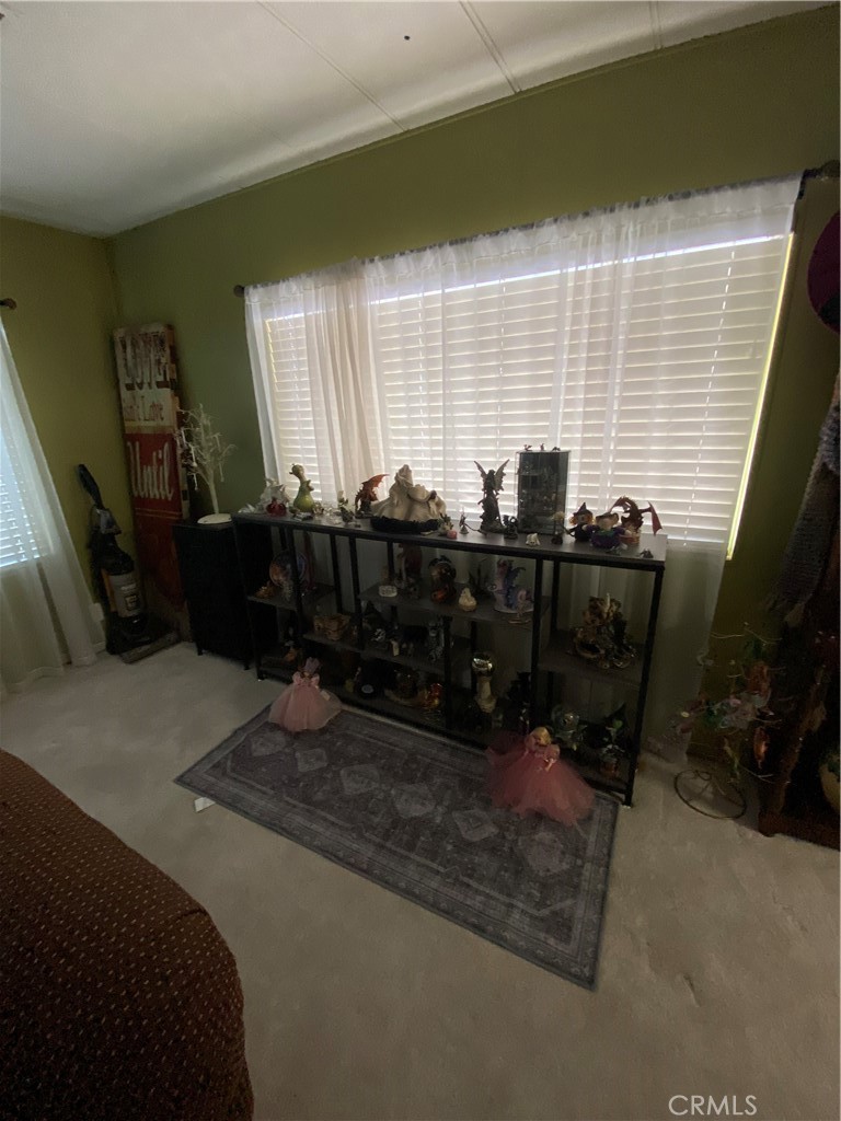 12680 4th Street, Unit 39 Yucaipa, CA 92399 - Photo 9 of 45 a view of a bedroom with furniture and windows
