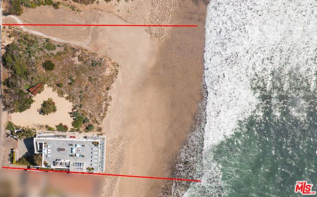 a view of a hallway with furniture and front door