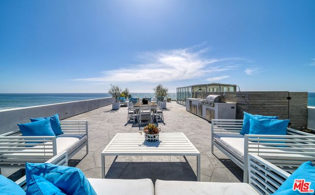 a view of kitchen with furniture and stove