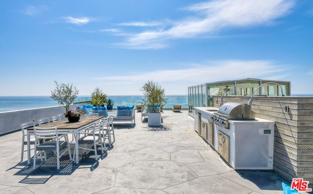 a view of a terrace with wooden floor and a terrace view