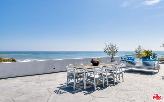 a view of an ocean and a mountain