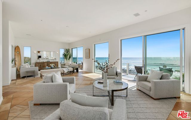 a bed room with a bed and a chair