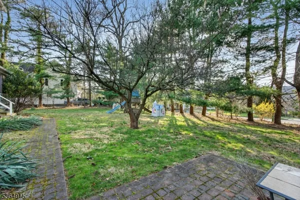a tree in the garden of a house