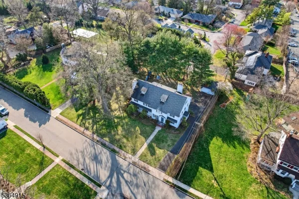 an aerial view of house with yard
