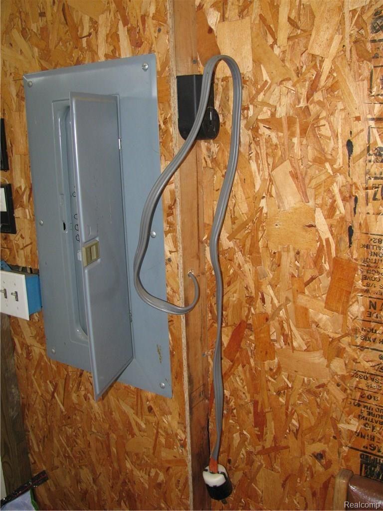 6045 Patrick Road North Branch, MI 48461 - Photo 42 of 44 Electrical in garage includes 220v for welder and generator.