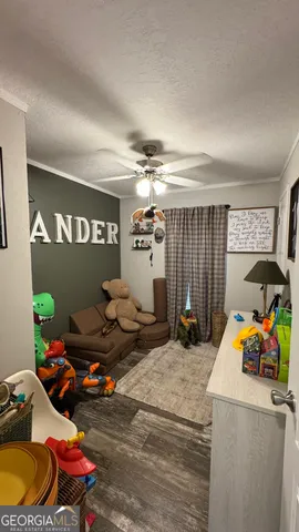 a bathroom with a sink a toilet and shower curtain