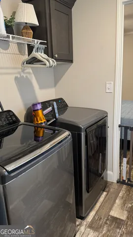 a utility room with dryer and washer