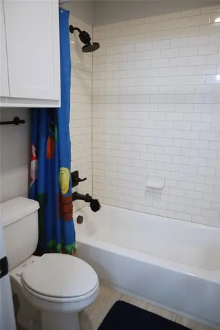 a bedroom with a bed and with chair