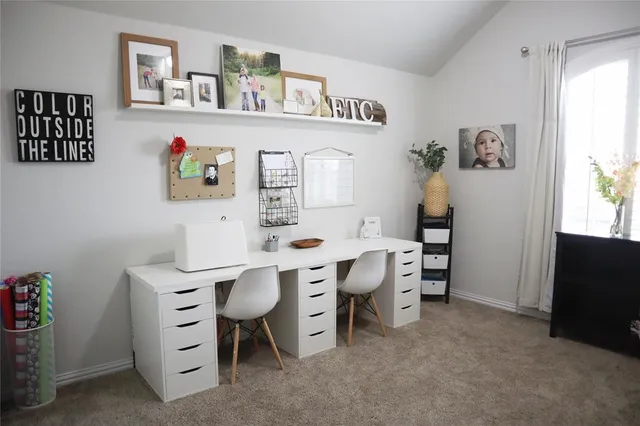 a workspace with furniture and window