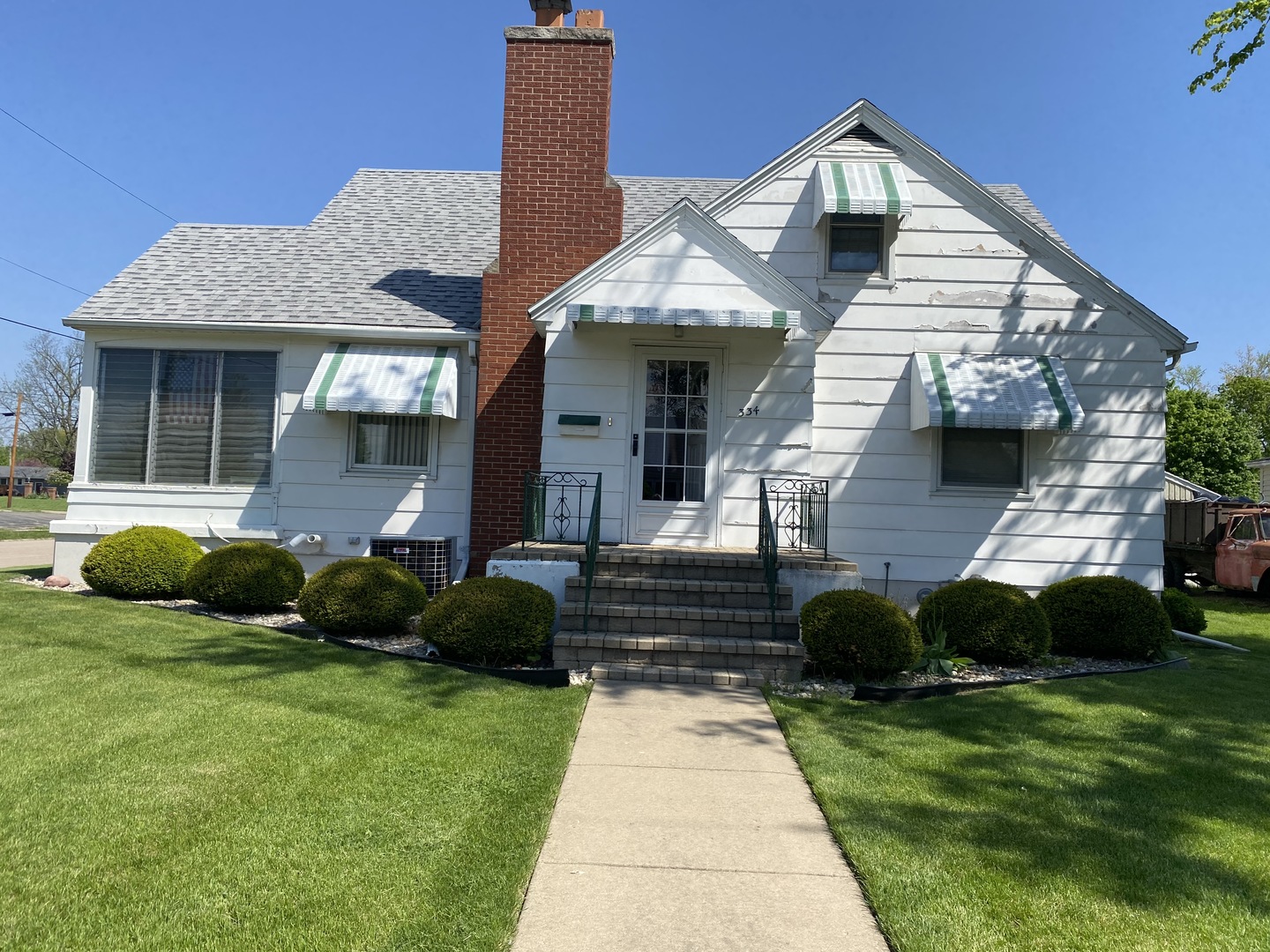 334 Clark Street Oglesby, IL 61348 - Photo 8 of 8 a front view of a house with garden