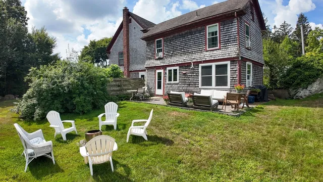 a view of a two chairs in a yard