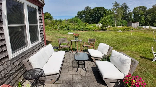 a bedroom with a bed and a tv on table