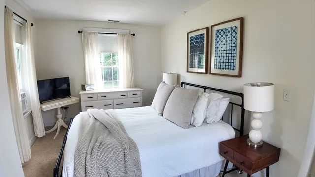 a bathroom with a sink toilet and mirror