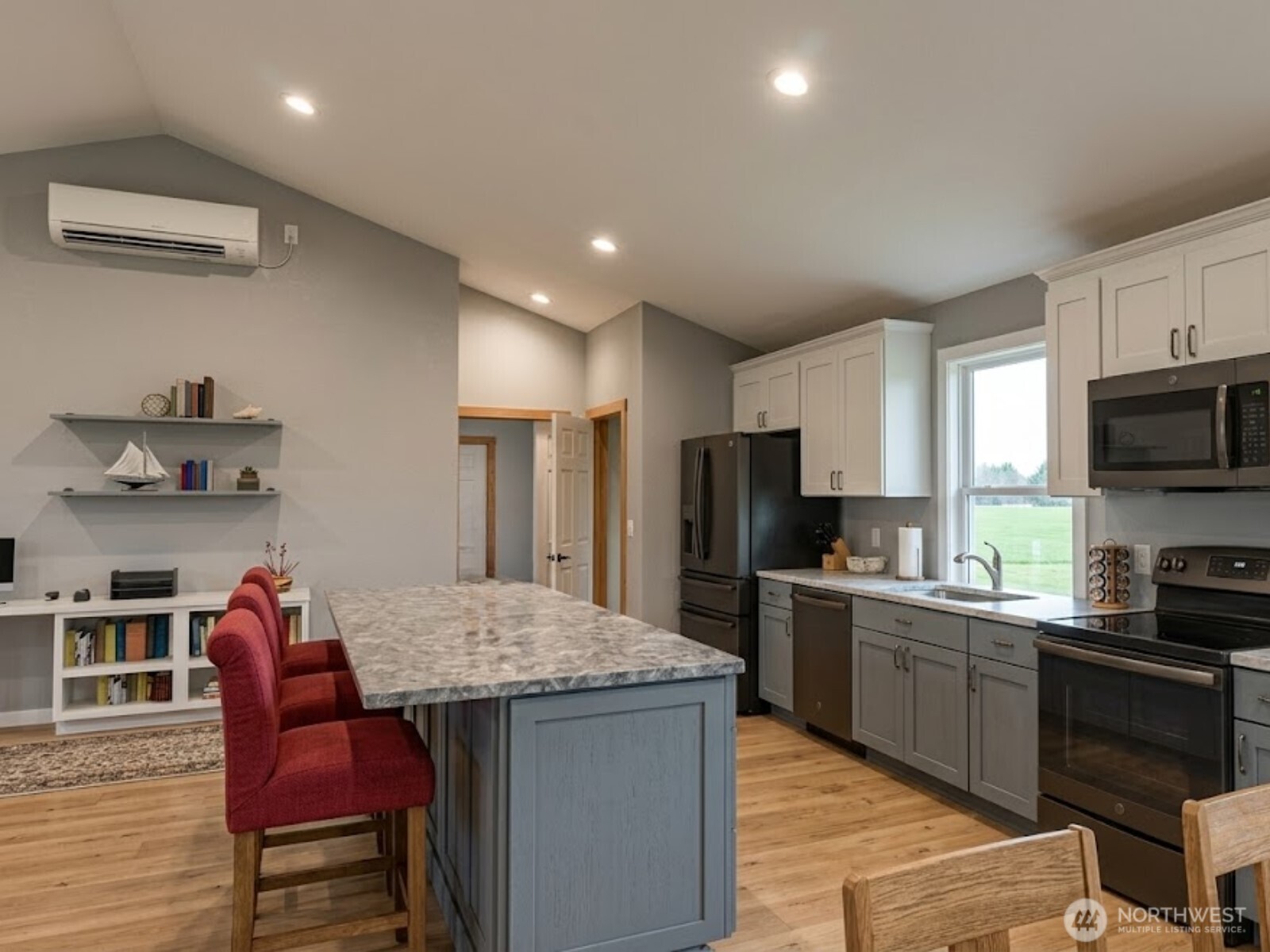 5 Endor Heights Vader, WA 98593 - Photo 7 of 15 a kitchen with stainless steel appliances granite countertop a kitchen island hardwood floor sink stove dining table and chairs