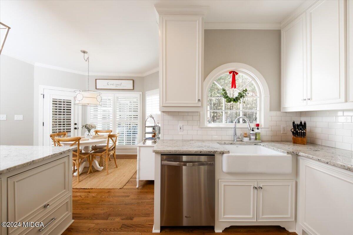 7701 Whittle Road Macon, GA 31220 - Photo 13 of 56 a kitchen with a sink cabinets and dining table