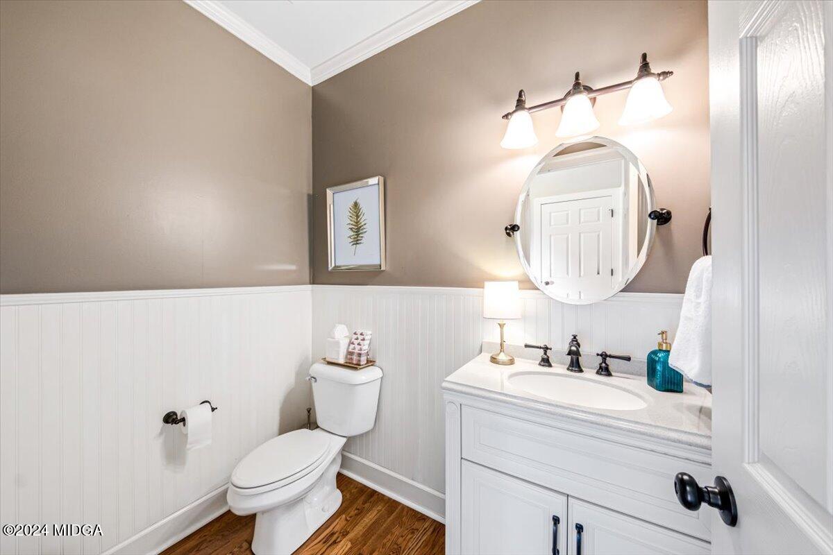 7701 Whittle Road Macon, GA 31220 - Photo 17 of 56 a bathroom with a toilet sink and mirror