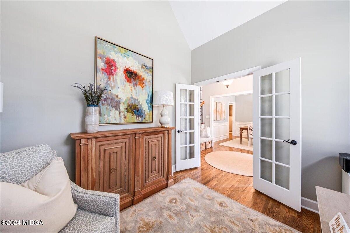 7701 Whittle Road Macon, GA 31220 - Photo 20 of 56 a living room with furniture a rug and white walls