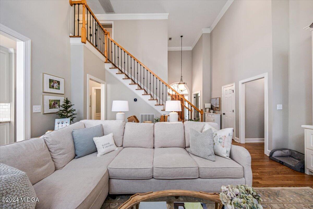 7701 Whittle Road Macon, GA 31220 - Photo 30 of 56 a living room with furniture or stairs and a couch