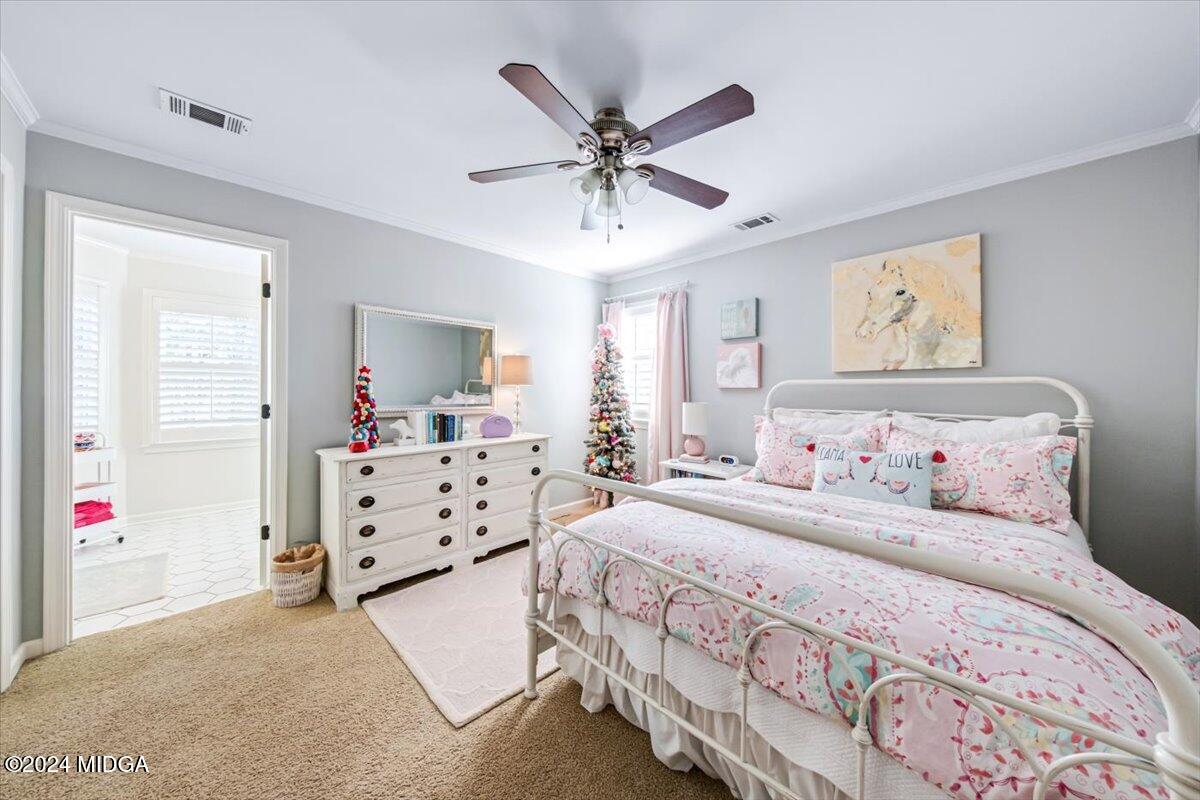 7701 Whittle Road Macon, GA 31220 - Photo 31 of 56 a bedroom with bed and ceiling fan