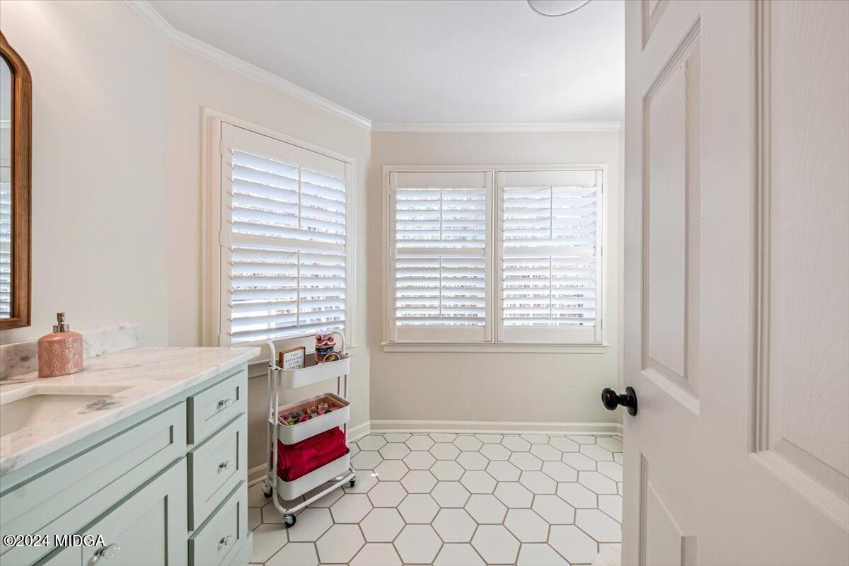 7701 Whittle Road Macon, GA 31220 - Photo 33 of 56 a bathroom with a granite countertop sink and a mirror
