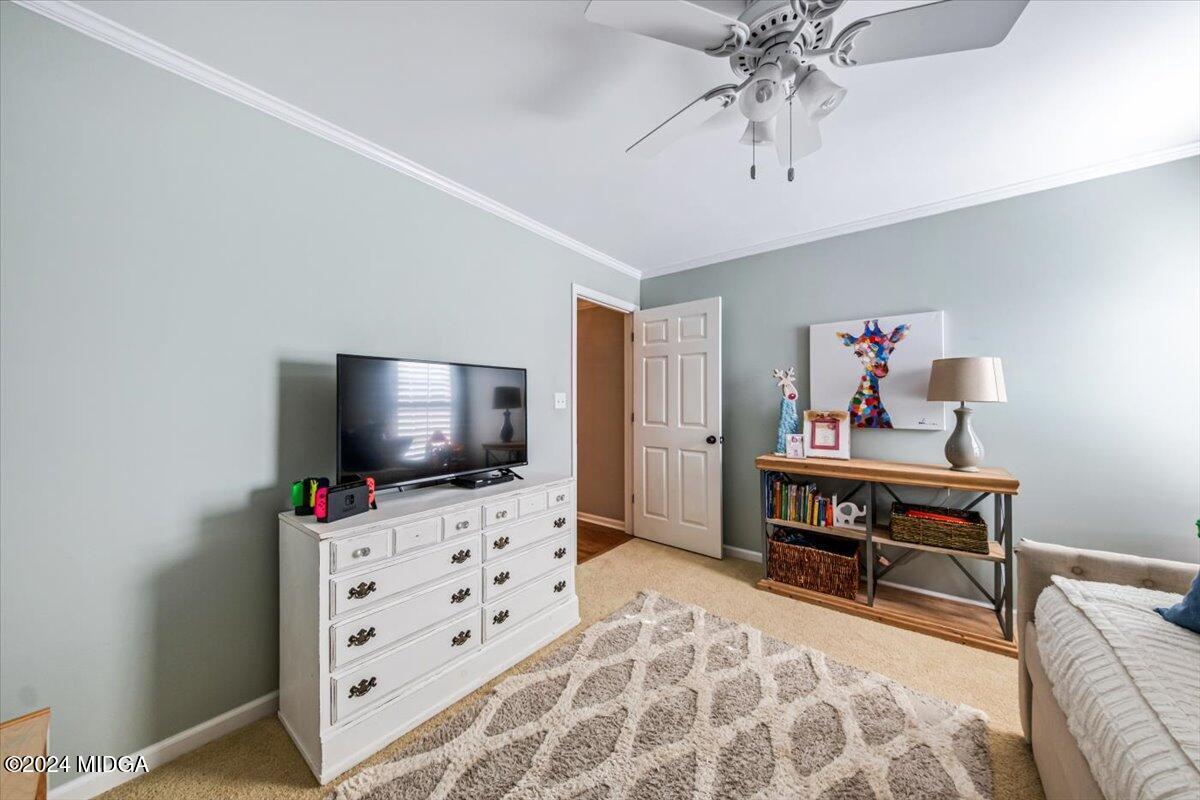 7701 Whittle Road Macon, GA 31220 - Photo 35 of 56 a living room with furniture and flat screen tv