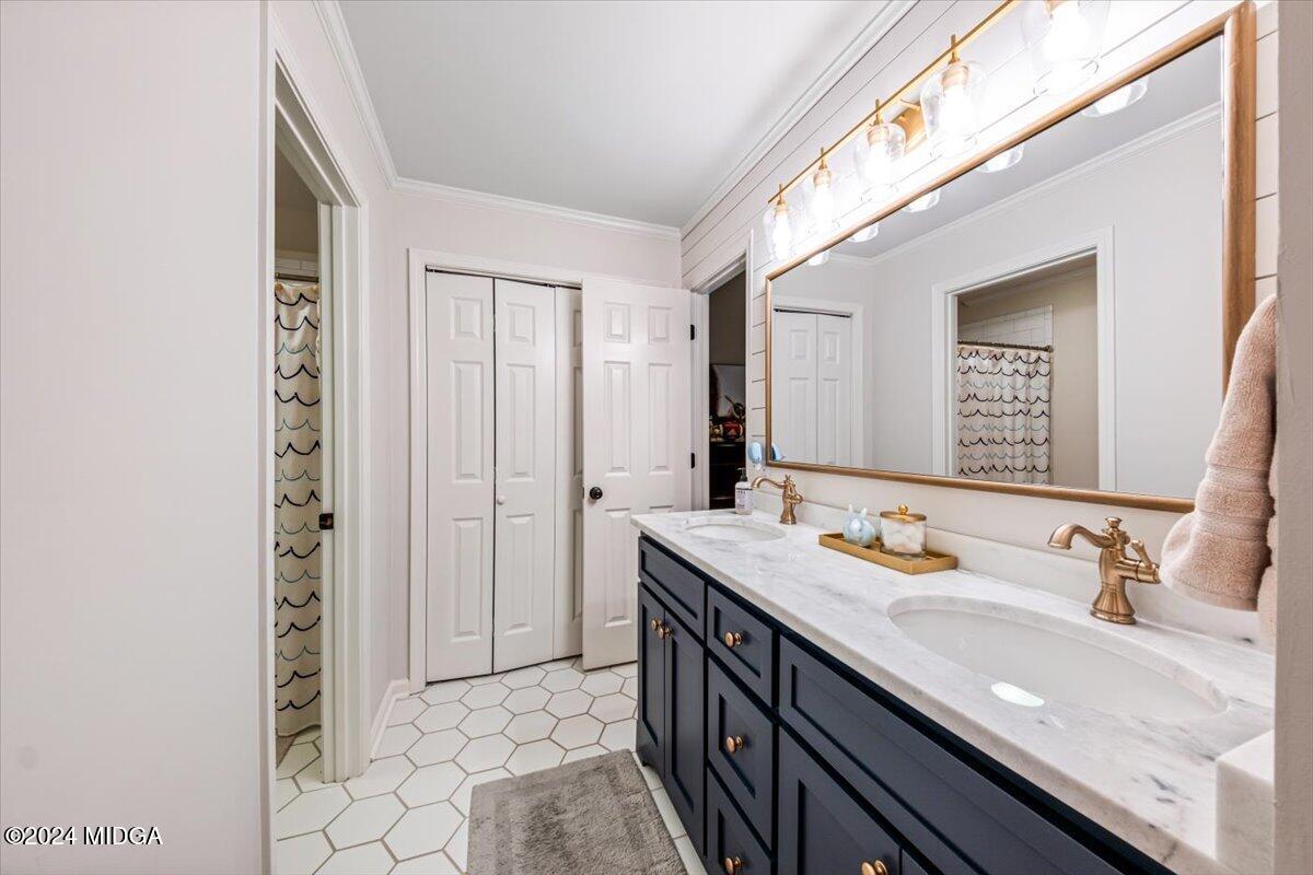 7701 Whittle Road Macon, GA 31220 - Photo 36 of 56 a bathroom with a granite countertop sink and a mirror