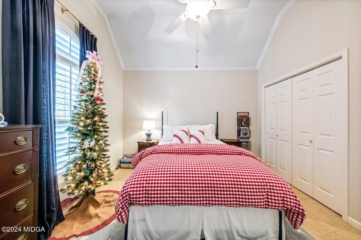 7701 Whittle Road Macon, GA 31220 - Photo 37 of 56 a bedroom with a bed and a window