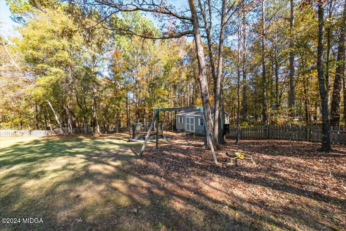 7701 Whittle Road Macon, GA 31220 - Photo 46 of 56 a view of a tree in the middle of a yard