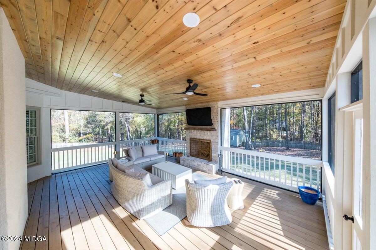 7701 Whittle Road Macon, GA 31220 - Photo 5 of 56 a living room with furniture and a fireplace