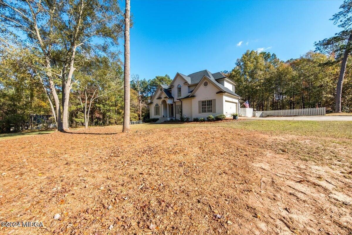 7701 Whittle Road Macon, GA 31220 - Photo 56 of 56 a view of a house with a yard