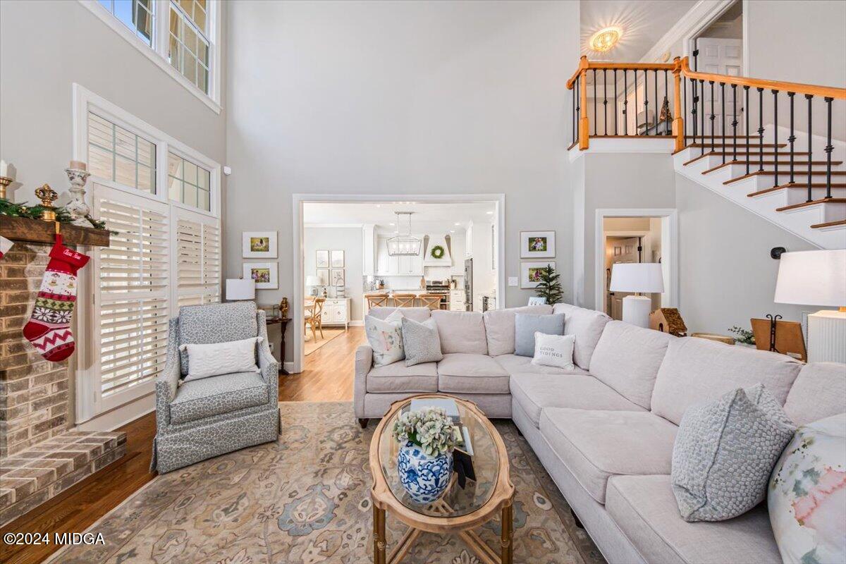 7701 Whittle Road Macon, GA 31220 - Photo 8 of 56 a living room with furniture a couch and a fireplace