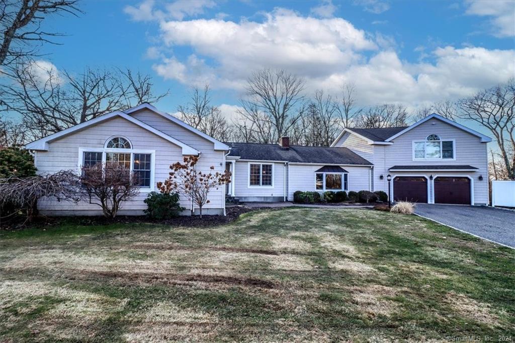 10 Fox Den Road Danbury, CT 06811 - Photo 1 of 1 a front view of a house with a garden