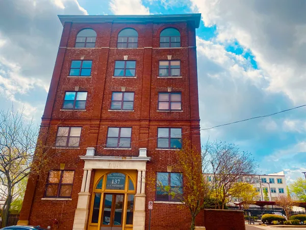 a front view of a multi story residential apartment building