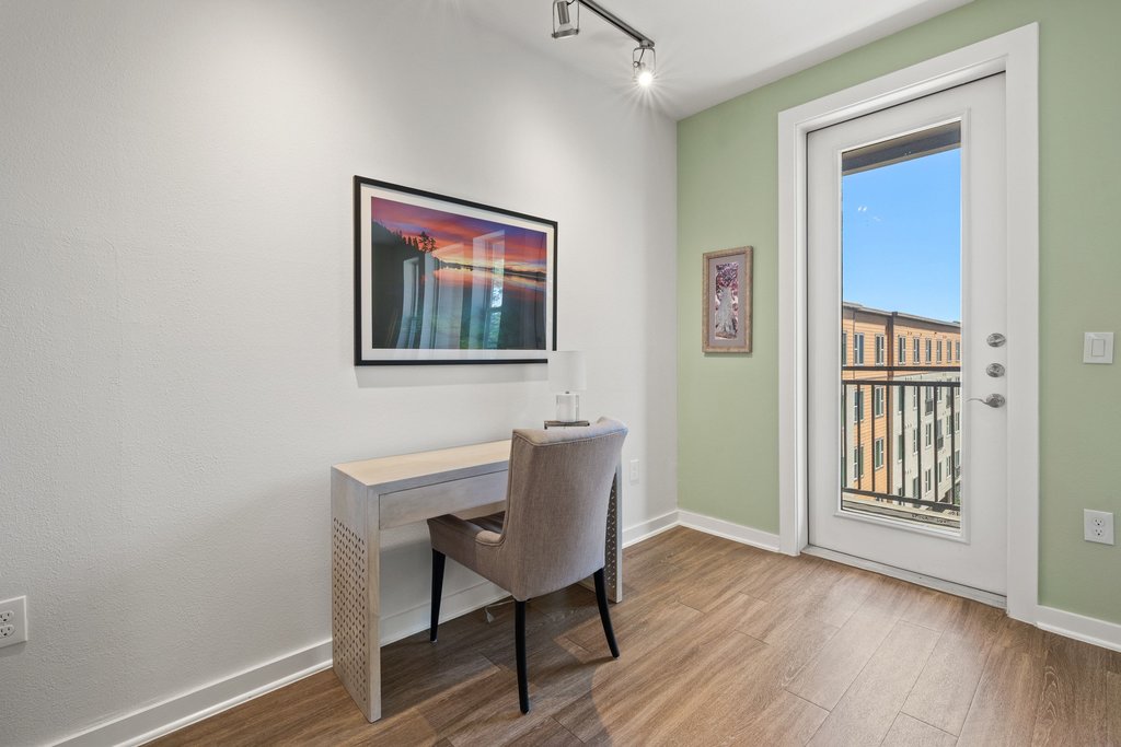1900 Barton Springs Road, Unit 5009 Austin, TX 78704 - Photo 13 of 35 Functional workspace with plank flooring and direct balcony access.