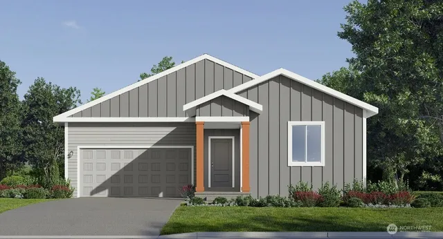 a view of a house with yard and plants