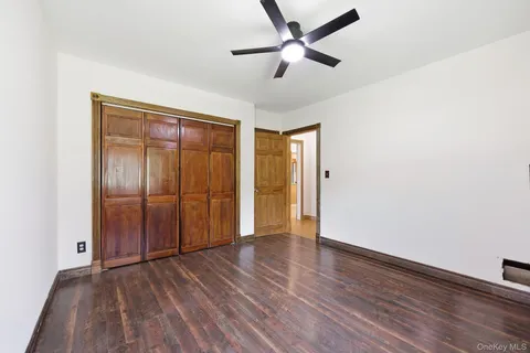 a view of an empty room and wooden floor