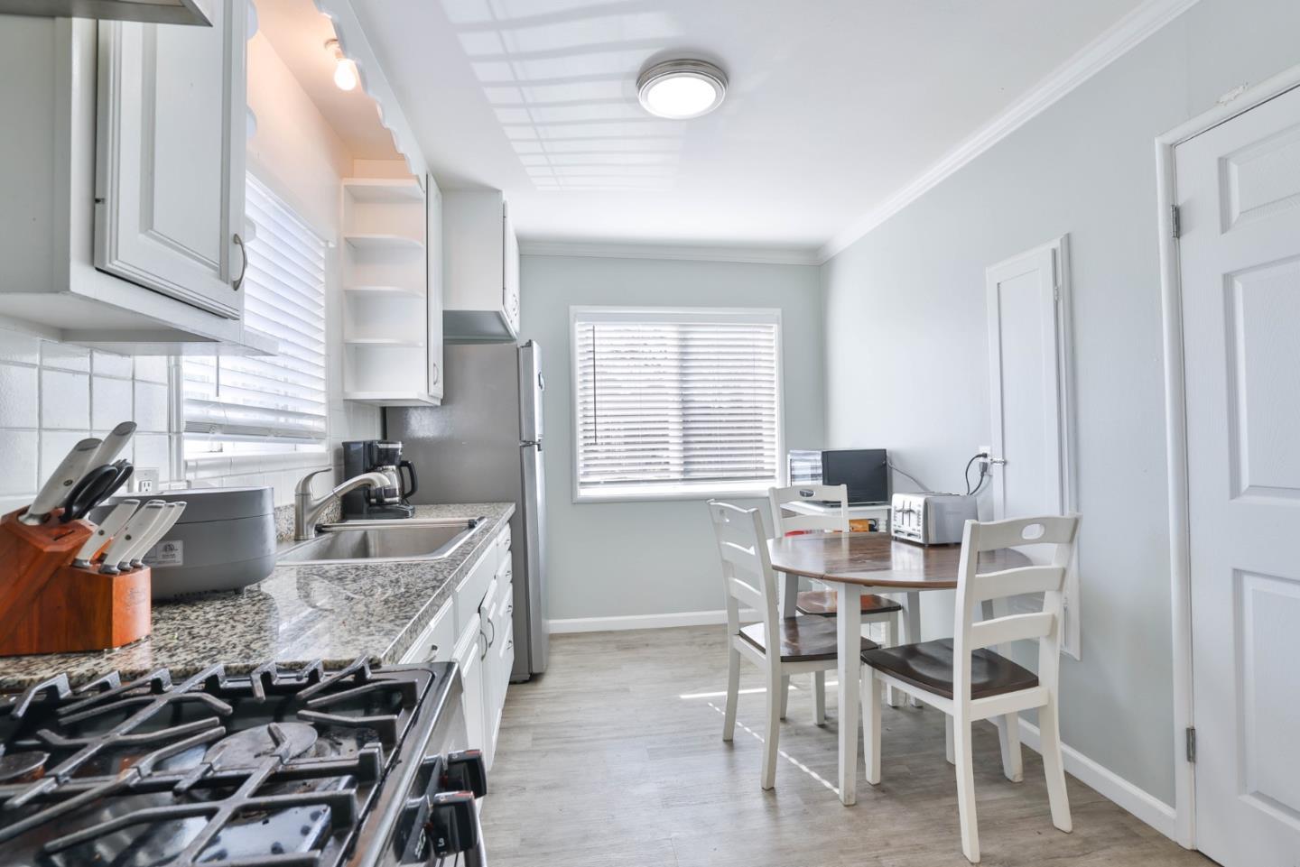 1431 Dwight Way Berkeley, CA 94702 - Photo 12 of 21 a kitchen with a table and chairs in it